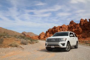From Bays to Playgrounds: Exploring Australia with Short-Term Car Hire 2 parked white Ford Explorer SUV