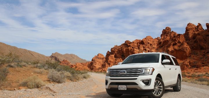 parked white Ford Explorer SUV