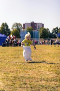 Child jumping in a sack race outdoors