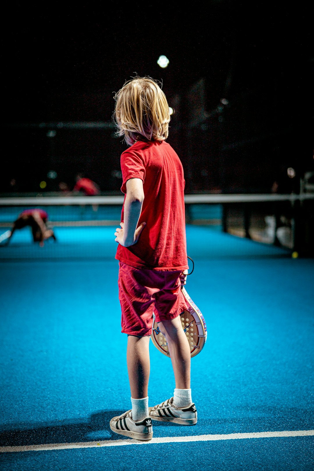 Serve Up Some Fun with Pickleball - A Free Holiday Activity for Kids in Childers 1 girl in red t-shirt and black pants running on blue floor